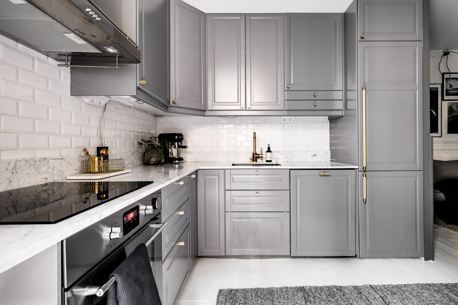 White + Gray Kitchen with Brass Hardware