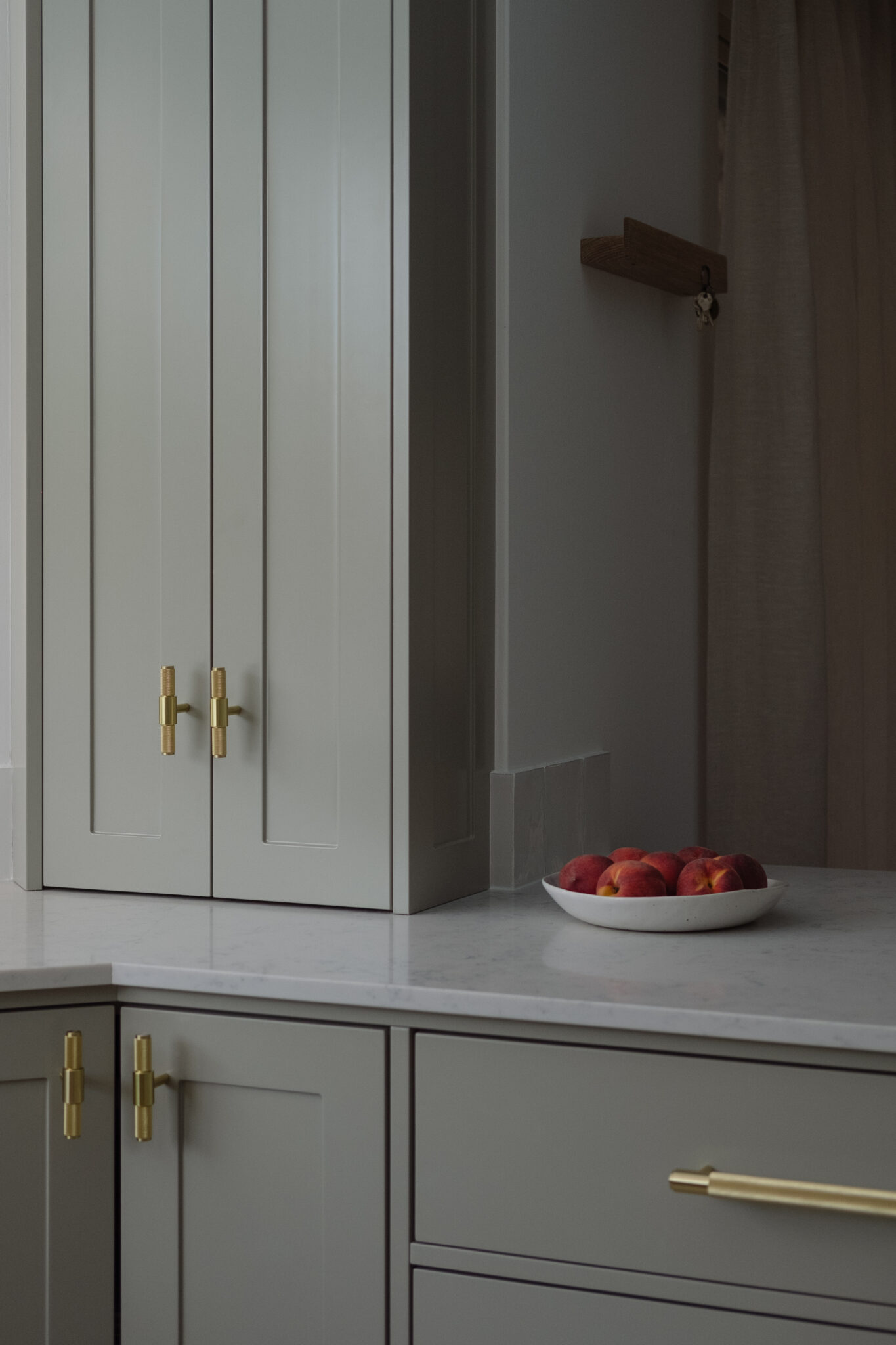 Warm grey kitchen with Brass details - Buster + Punch